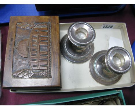 A Pair of Dwarf Candlesticks, each stamped "Sterling" "Weighted"; together with a 'Jerusalem' trinket box. (3)