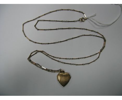A Long Fancy Link Chain, suspending engine turned heart shape locket pendant.