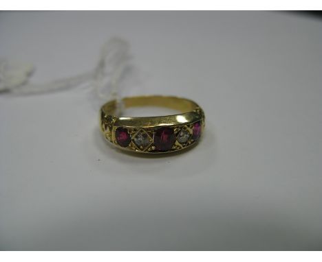 A Victorian Ruby and Diamond Five Stone Ring, graduated set with three oval rubies, spaced by two old cut diamonds, stamped "