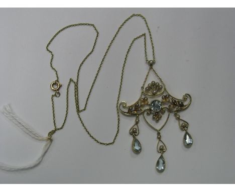 An Edwardian Openwork Seed Pearl Set Pendant, of scroll design, with triple collet set drops, stamped "15ct" on fine link int