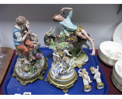 Capodimonte Group Study of A Young Boy and Girl, playing the recorder, on naturalistic base; a boy eating grapes on a donkey;