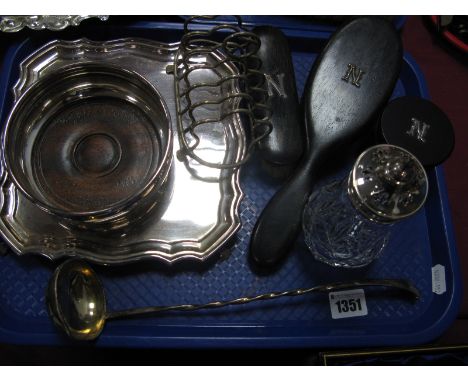 A Toddy Ladle, with twisted handle, glass sugar sifter, dressing table items, toast rack, waiter, bottle coaster:- One Tray