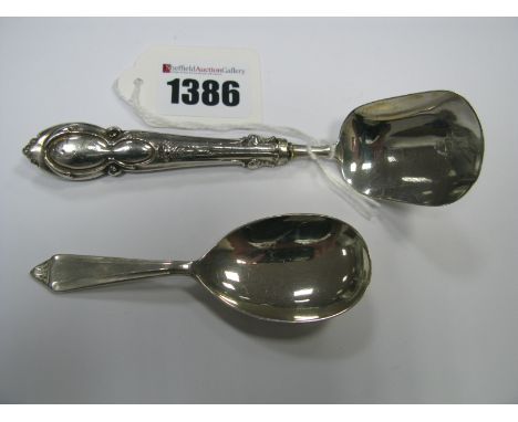A Hallmarked Silver Caddy Spoon, FH, Sheffield 1973; together with a shovel style spoon. (2)