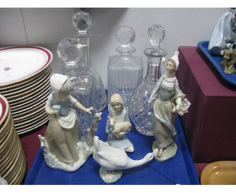 Four Lead Crystal Spirit Decanters, a Nao model of a young girl with butterfly and other models:- One Tray