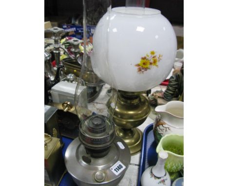 An Early XX Century Brass Oil Lamp, with a glass funnel and shade; together with one other oil lamp. (2)