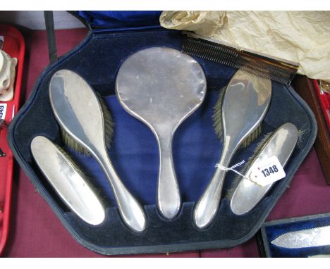  A Hallmarked Silver Backed Five Piece Dressing Table Set, each of plain design, with associated comb, in original fitted cas