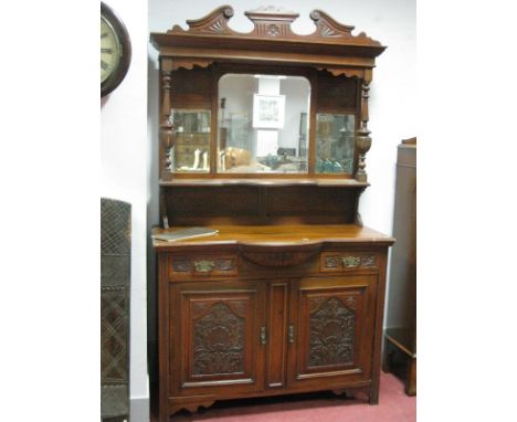 An Early XX Century Walnut Mirror Back Sideboard, with a swan neck pediment, mirror back turned supports, single shelf, base 