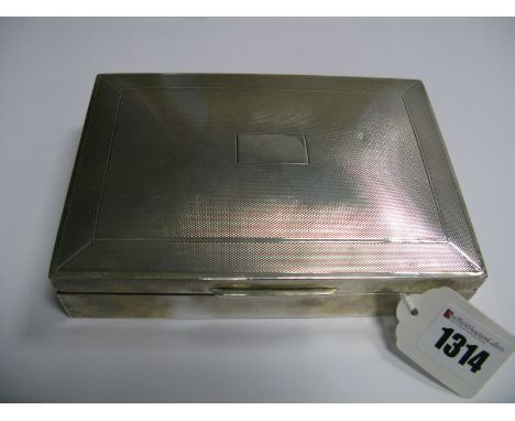 A Hallmarked Silver Cigarette Box, of shallow rectangular form, the hinged lid engine turned, 16.5cm wide.