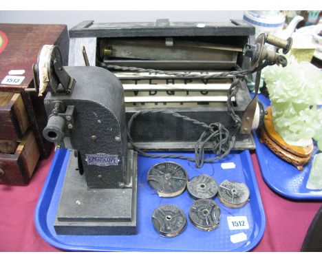 A 1920's 'Bingo Scope' Home Cinema Projector, a collection of Pathe and Baby films, and a vintage opticians letter recognitio