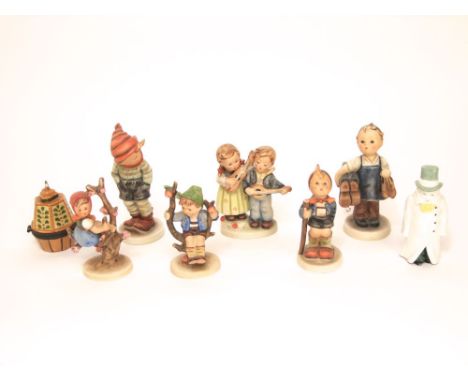 A collection of six Hummel figures of children including musicians, shoe maker, etc together with a Royal Worcester candle st