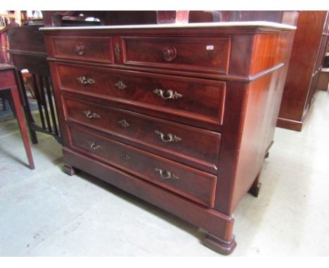 A substantial 19th century continental mahogany commode of three long and two short drawers set beneath a white marble top, 1