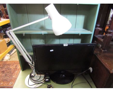 A Flatron M2262D flat screen television with handset together with an angle poise table lamp