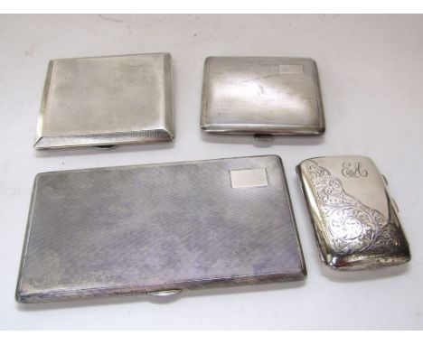 Four various silver cigarette cases to include three engine turned examples and another engraved with scrolled acanthus, 16oz