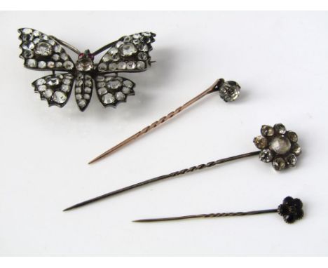 A Victorian silver open set rock crystal brooch in the form of a butterfly together with three stick pins