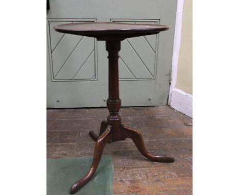 A Georgian mahogany tripod table, circular dished top, 50cm diameter raised on a turned gun barrel shaped tripod base