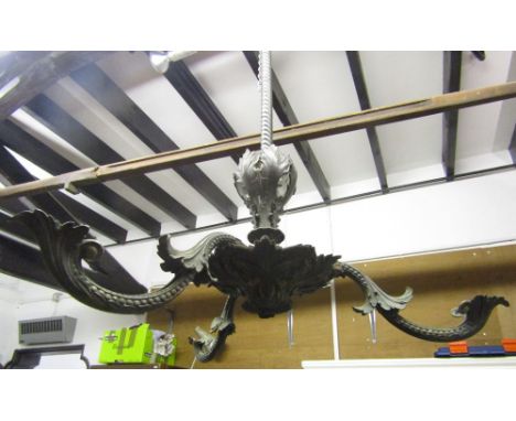 A 19th century hanging cast metal ceiling light with rope twist stem, acanthus leaf and three scrolling branches
