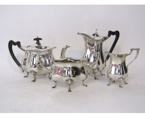 Attractive four piece silver tea service comprising tea pot, water jug, milk jug and sucrier, of lobed form with gadrooned bo