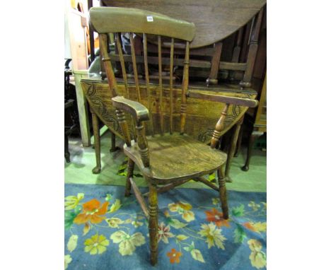 A Windsor stick back elbow chair in beech and elm