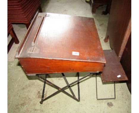 A vintage stained pine school desk with folding steel supports together with a matching stool