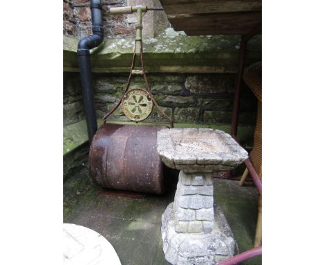 A vintage cast iron garden roller with T shaped handle and circular plaque with lettering Parsons Brothers, Gloucester, toget