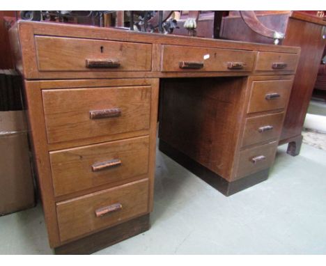 A set of three graduated ironwork tables with plate glass tops, a box commode and an oak pedestal writing desk fitted with ni