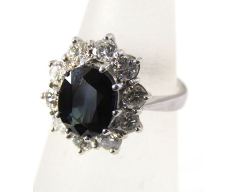 An 18ct white gold diamond and sapphire ring, size J/K, 5g