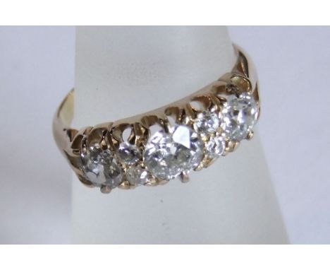 An 18ct diamond ring set with seven diamonds, size K/L, 4g