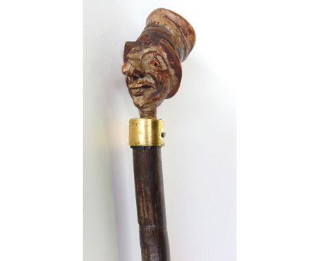 Walking cane with knop being the head of a chimney sweep wearing a top hat, 88cm long
