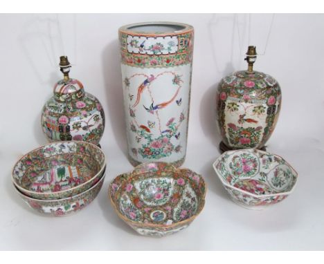 A quantity of reproduction oriental ceramics in the Cantonese manner comprising two lamp bases, a cylindrical vase or umbrell