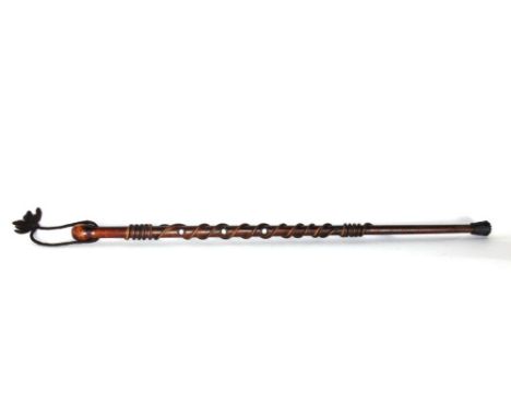 An unusual walking stick fitted with mother of pearl tablets and snake like relief detail, 94cm long