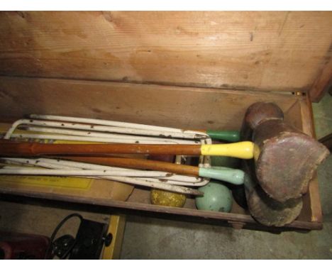 A vintage Slazenger pine croquet box containing three croquet mallets, five balls, five hoops and a kum-bak Wimbledon model t
