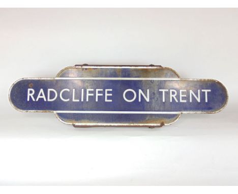Railwayana interest - vintage enamel sign for Radcliffe on Trent station upon an iron bracket, 92 cm long x 26 cm high