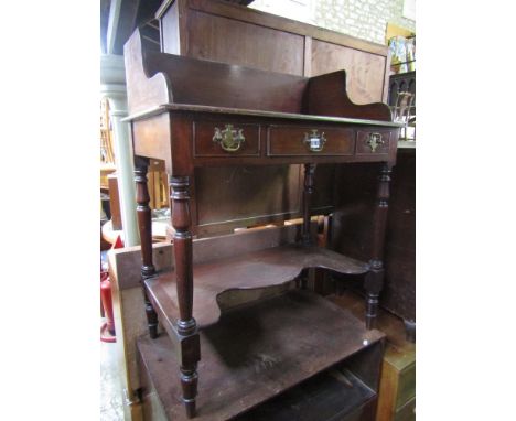 A mid 19th century mahogany washstand with three quarter gallery raised on turned supports with under shelf and a further 19t