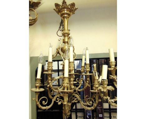 A very good quality cast brass 10 branch chandelier, the arms with scrolled and acanthus detail, the central column with lion