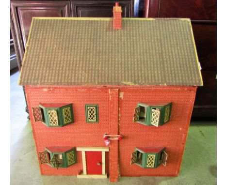 A vintage dolls house with mock red brick work facade (possibly Triang)