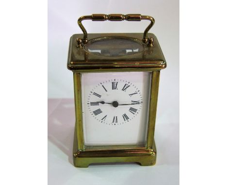 Small French carriage clock within brass cornice case fitted with a bevelled glass plate