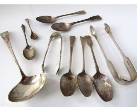 Mixed collection of various Georgian and later spoons to include a sauce ladle and pair of sugar nips, 6oz approx 