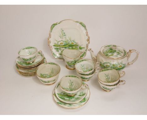 Royal Paragon "Waterlily" pattern tea service comprising teapot, milk jug, sucrier, sandwich plate and six trios