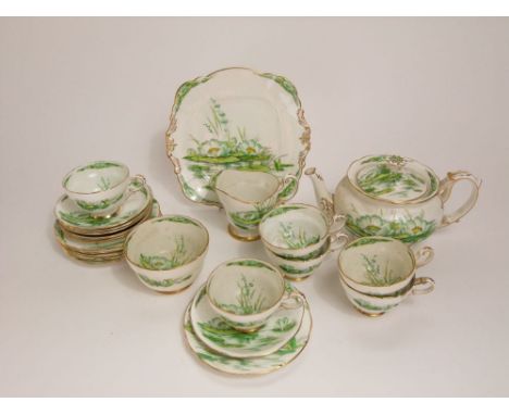 Royal Paragon "Waterlily" pattern tea service comprising teapot, milk jug, sucrier, sandwich plate and six trios