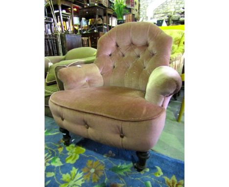 A Victorian button back drawing room chair of open form on turned supports