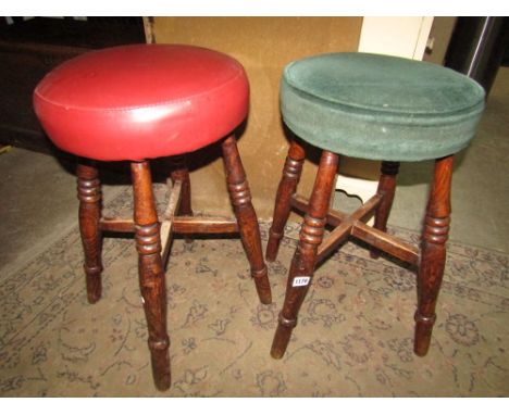Two pairs of elm and beechwood pub stools of varying design, the circular upholstered seats raised on ring turned supports