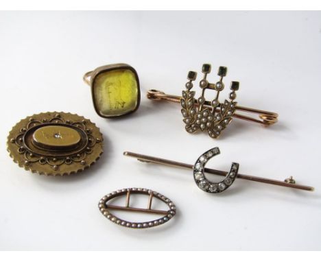 Three brooches, two set with diamonds and another with seed pearls and green stones together with an intaglio ring and a seed