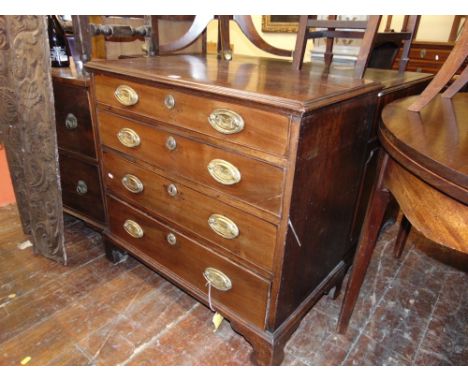 A small George III mahogany chest of four long graduated drawers raised on bracket supports, 85 cm wide