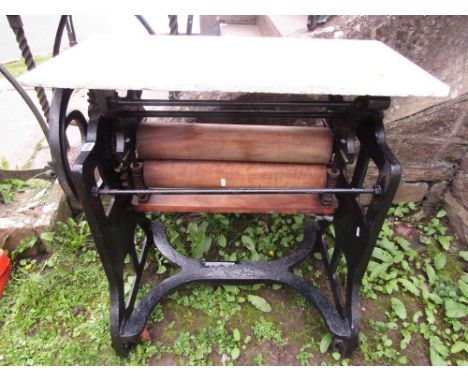 The Stowaway vintage cast iron mangle/ringer with later associated rectangular white marble and grey flecked top