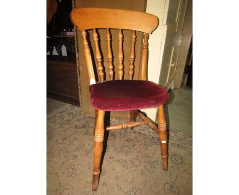 A set of six modern stained beechwood Windsor spindle back dining chairs raised on ring turned supports united by stretchers