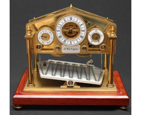 A late twentieth century Congreve rolling ball clock by Devon Clocks, England. The 6 cm white dial with Roman numerals, blued