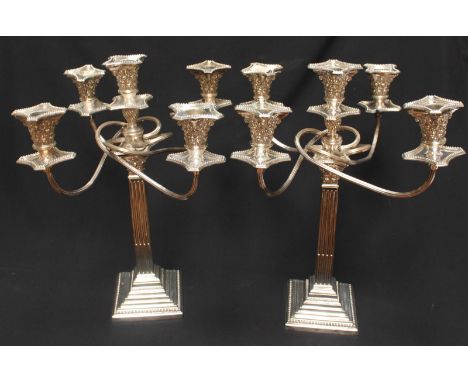 A good quality pair of silver-plated five-light candelabra, modelled as classical square-section Corinthian columns with deta