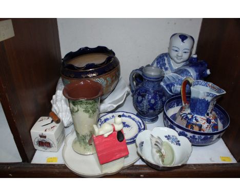 SECTION 8. A collection of assorted ceramics including a Chinese boy holding a fish, a Doulton planter, blue and white jug, a