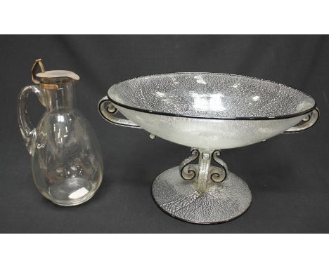 A Hukin & Heath glass decanter with vertically panelled ovoid body, drawn handle and silver-plated hinged cove, 20cm high, to
