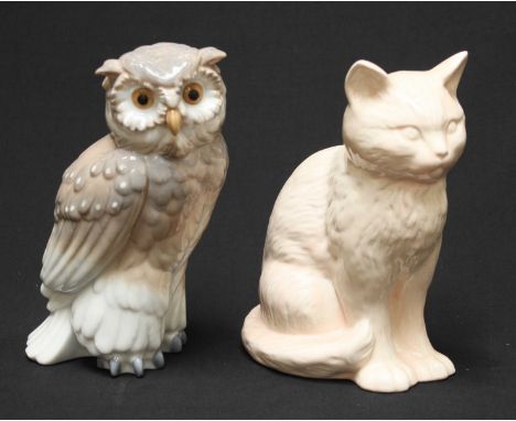 A Nao figure of an owl, together with a Sylvac figure of a seated cat. Both 17.5 cm high.